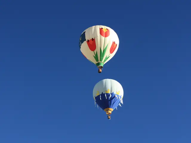 Hot air balloons ascend in Bristol's sky, making dozens appear.